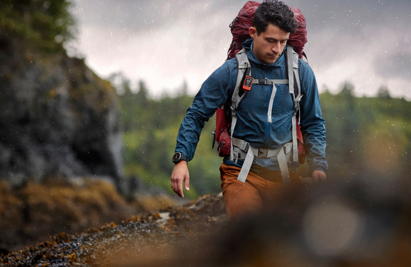 Hiker wearing a satellite communicator on shoulder strap