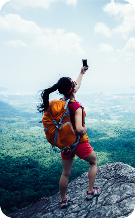 Outdoor enthusiasts hiking off the grid while staying connected with a personal satellite device